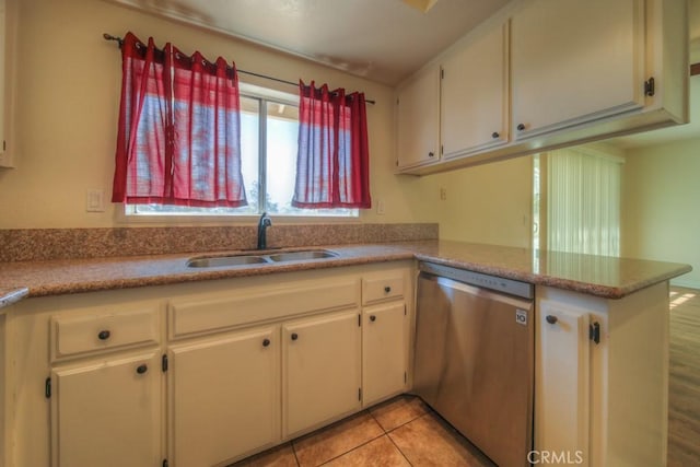 8371 Hawthorne St, Rancho Cucamonga, CA 91701 - kitchen with stainless steel dishwasher, a peninsula, light countertops, white cabinetry, and light tile patterned floors