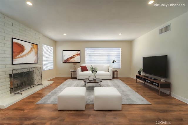 8371 Hawthorne St, Rancho Cucamonga, CA 91701 - living area with recessed lighting, wood finished floors, and a brick fireplace