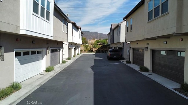 view of street with a residential view and a mountain view