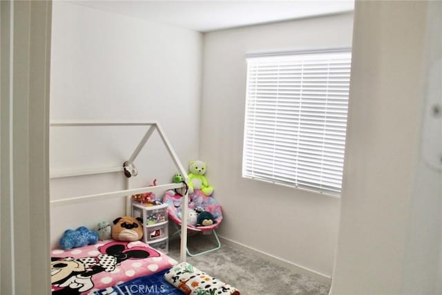 unfurnished bedroom featuring carpet flooring and baseboards