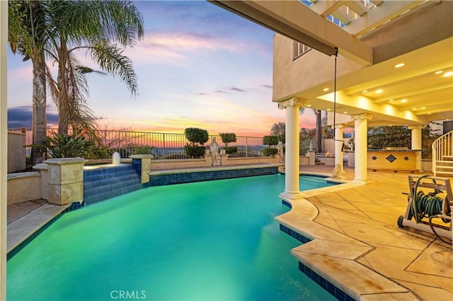 view of pool featuring a patio area, fence, and a fenced in pool