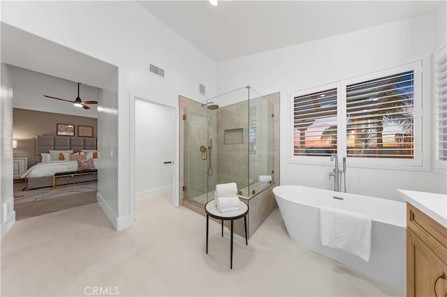 bathroom with connected bathroom, vanity, visible vents, a freestanding bath, and a stall shower