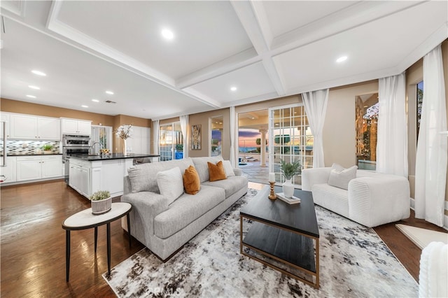 living room featuring coffered ceiling, dark wood finished floors, beam ceiling, and recessed lighting