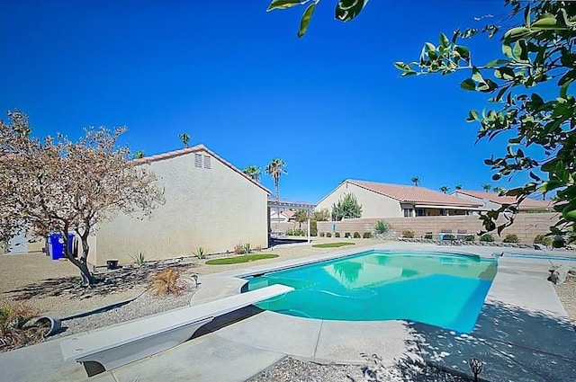 68262 Pasada Rd, Cathedral City, CA 92234 - view of pool with a diving board, a fenced backyard, and a patio