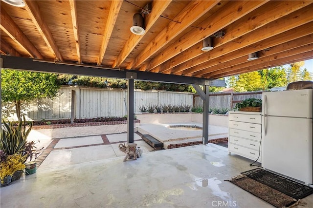 view of patio / terrace with fence and mail area