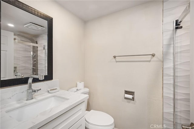 full bath featuring a stall shower, visible vents, vanity, and toilet