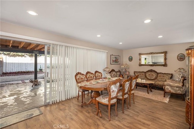 dining space featuring recessed lighting and wood finished floors