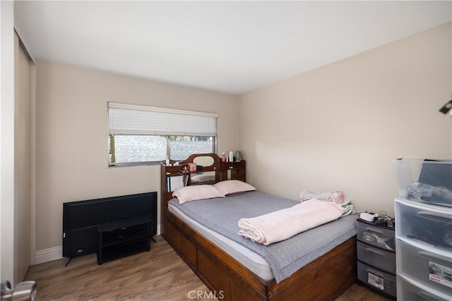 bedroom featuring wood finished floors