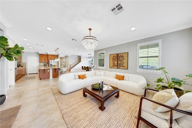 living area with recessed lighting, visible vents, crown molding, and stairway