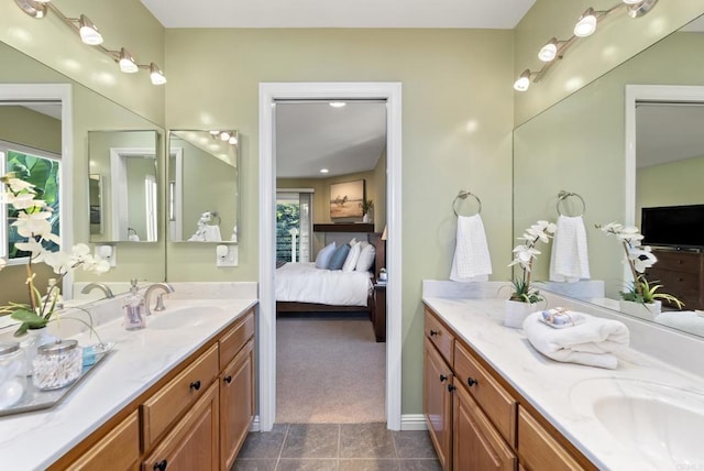 bathroom featuring tile patterned floors, connected bathroom, and vanity