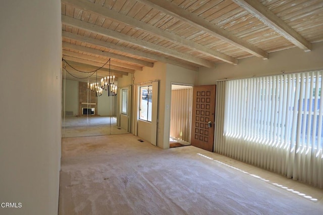 spare room with light carpet, wooden ceiling, beam ceiling, and a notable chandelier