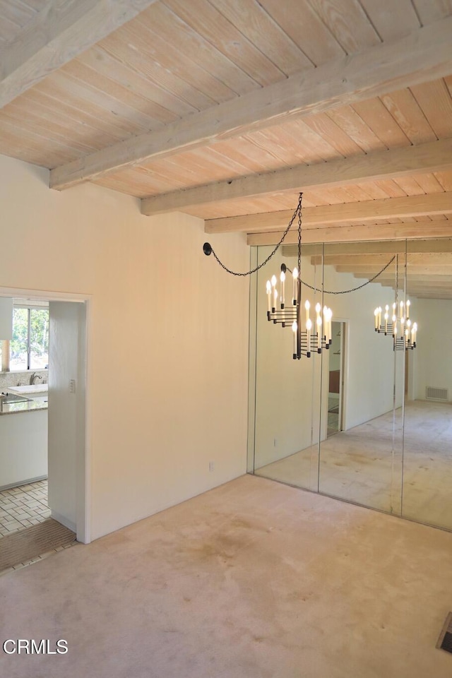 interior space with wood ceiling, visible vents, and beam ceiling