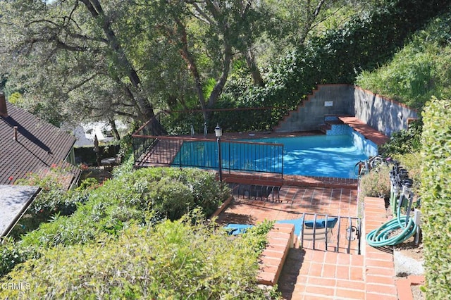 view of pool featuring stairs