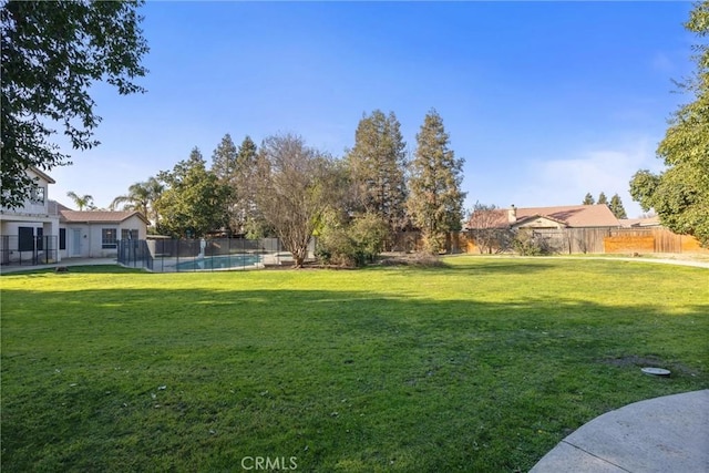 view of yard featuring a fenced in pool and a fenced backyard