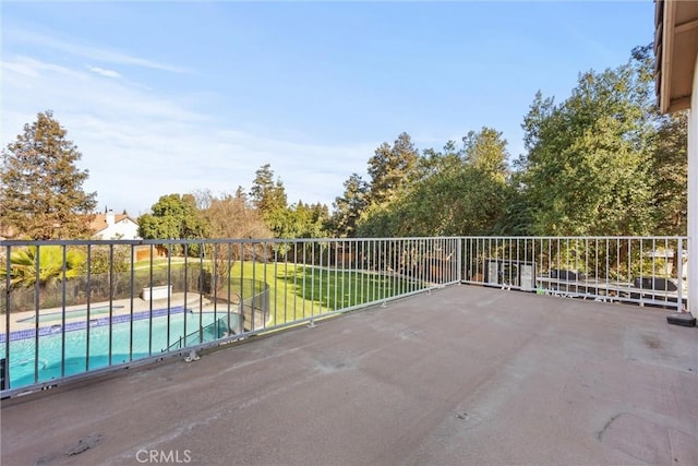 view of patio featuring a fenced in pool and fence