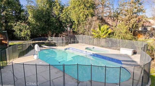 view of pool featuring a fenced in pool, fence, a patio, and an in ground hot tub