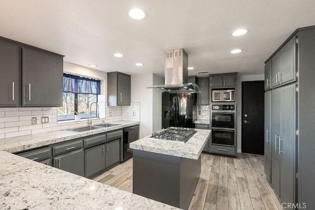 kitchen with island exhaust hood, gray cabinets, a kitchen island, a sink, and black appliances