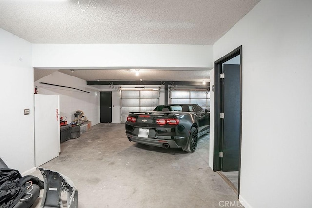 garage featuring freestanding refrigerator