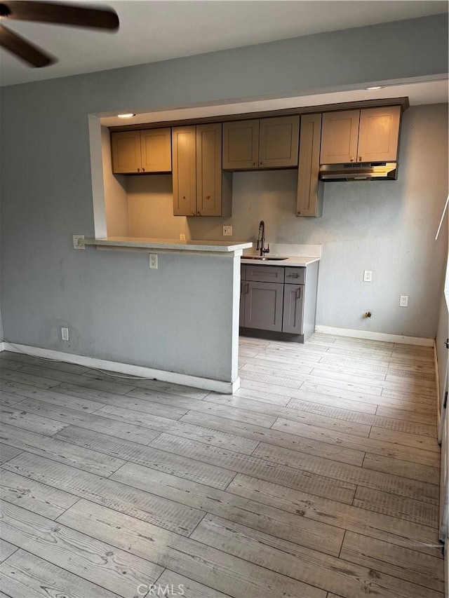 123 E Alondra Blvd, Compton, CA 90220 - kitchen with a sink, ceiling fan, baseboards, and light wood-type flooring