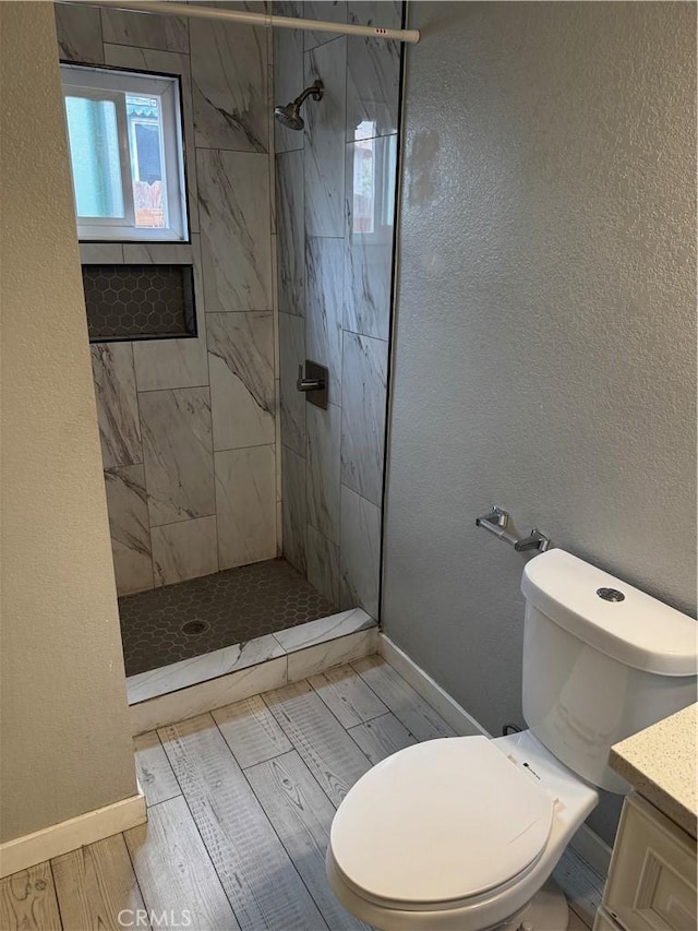 123 E Alondra Blvd, Compton, CA 90220 - bathroom featuring toilet, baseboards, vanity, and a stall shower