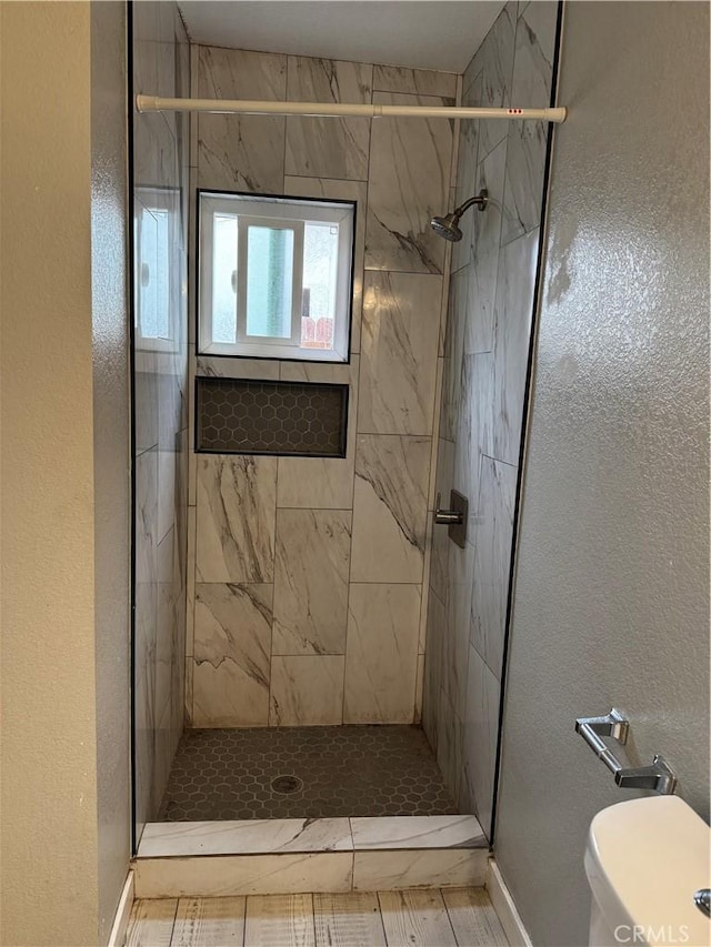 123 E Alondra Blvd, Compton, CA 90220 - full bath with toilet, baseboards, a stall shower, and a textured wall