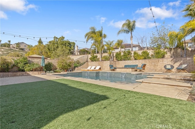 view of yard featuring a fenced backyard, a fenced in pool, and a patio