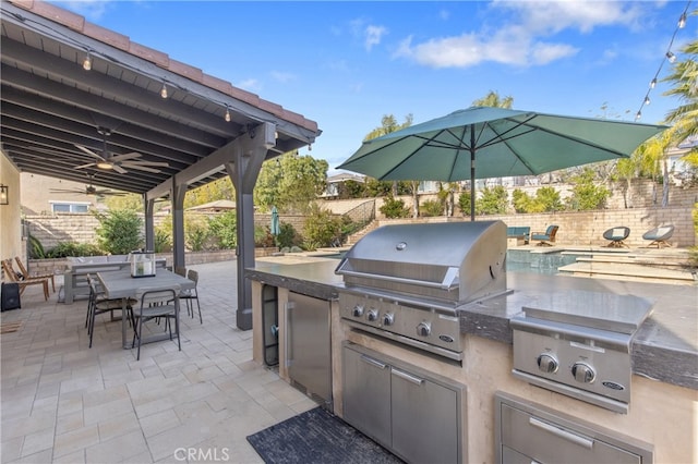 view of patio with a ceiling fan, area for grilling, a fenced backyard, a grill, and outdoor dining space