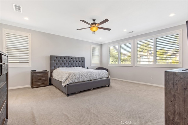 bedroom featuring baseboards, visible vents, and ornamental molding