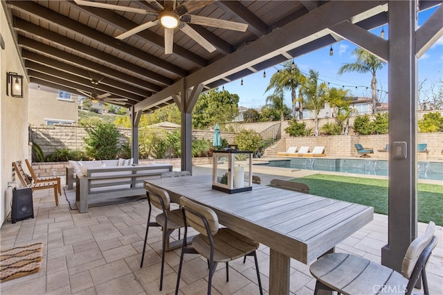 view of patio / terrace featuring outdoor dining space, a fenced backyard, ceiling fan, and an outdoor living space