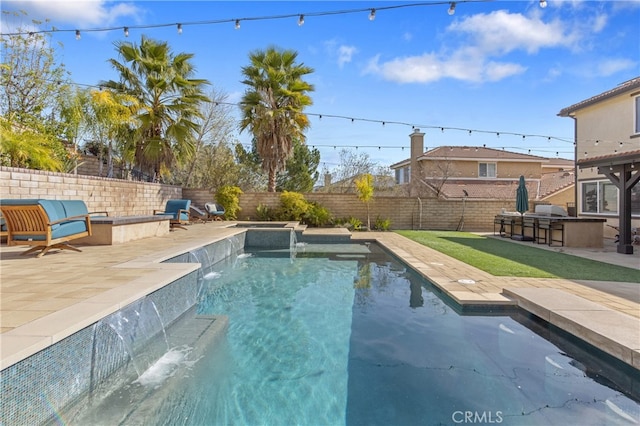 view of pool featuring a fenced backyard, grilling area, a fenced in pool, a bar, and a patio area