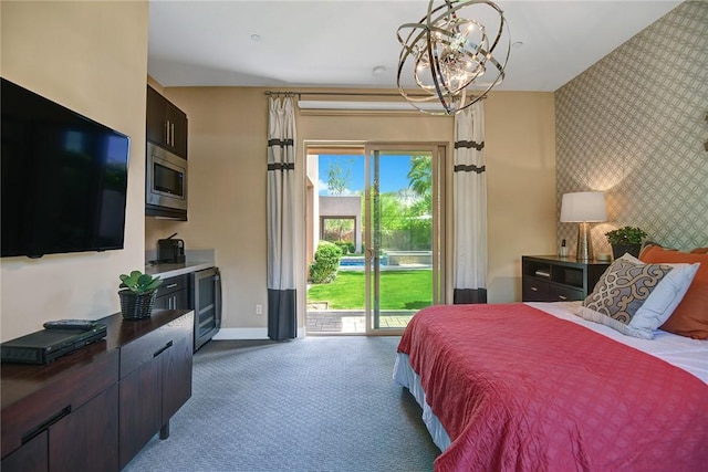 bedroom featuring an accent wall, baseboards, access to outside, carpet, and wallpapered walls