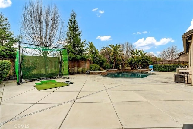 view of pool featuring fence and a patio
