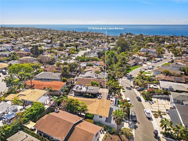 bird's eye view with a water view and a residential view