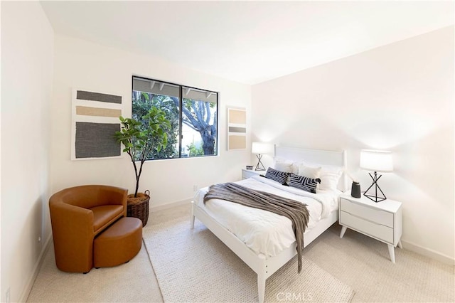 carpeted bedroom with baseboards