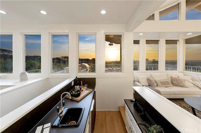 sunroom / solarium featuring a sink