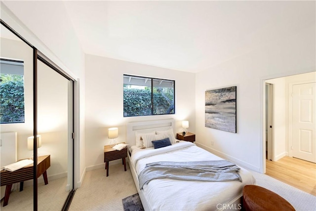 bedroom featuring baseboards and a closet