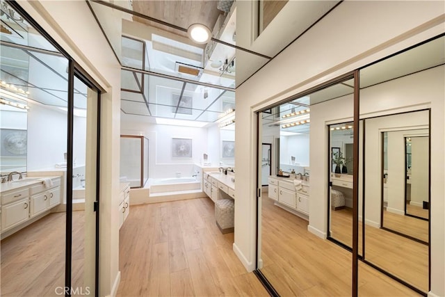 11 Montpellier, Newport Beach, CA 92660 - bathroom featuring vanity, a stall shower, a bath, and wood finished floors