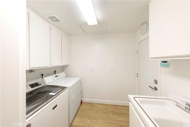 11 Montpellier, Newport Beach, CA 92660 - clothes washing area with cabinet space, washer and dryer, light wood-style flooring, and baseboards