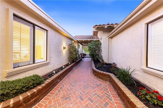 11 Montpellier, Newport Beach, CA 92660 - view of side of property featuring stucco siding and a tile roof