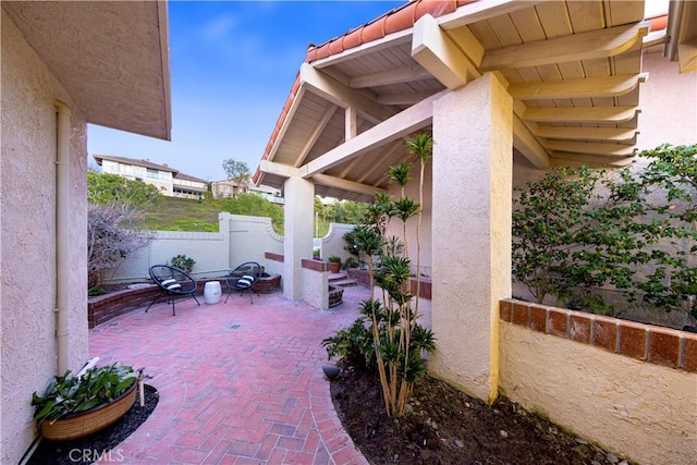 view of patio / terrace featuring an outdoor fire pit and fence private yard