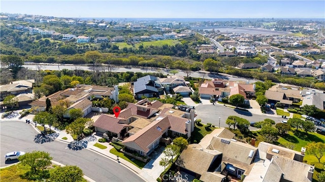 birds eye view of property with a residential view