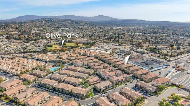 birds eye view of property with a residential view and a mountain view