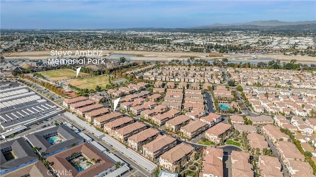 birds eye view of property with a residential view