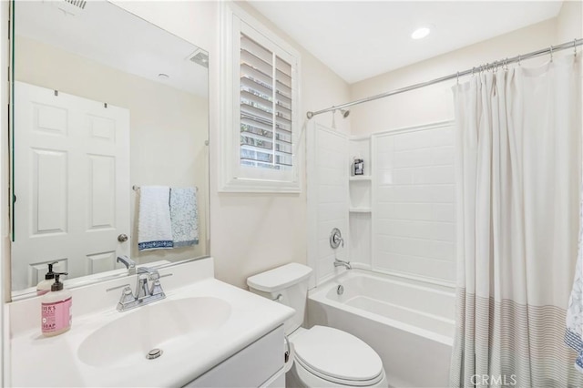 full bath with shower / bath combination with curtain, vanity, and toilet