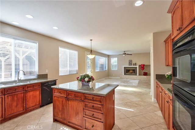23531 Hobart Ct, Murrieta, CA 92562 - kitchen with black appliances, a sink, light tile patterned floors, a kitchen island, and recessed lighting