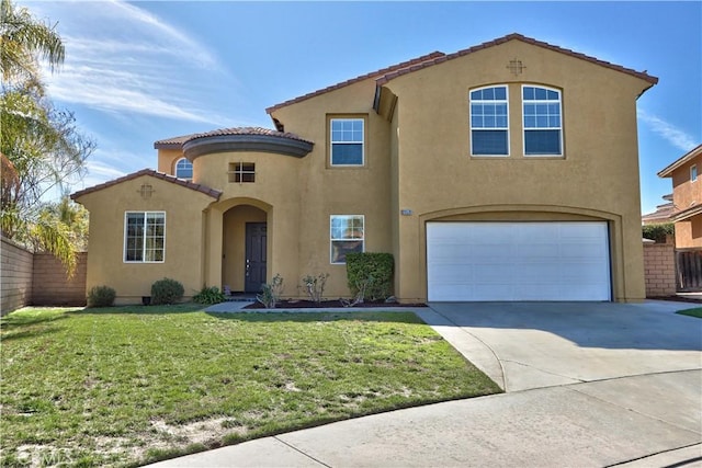 mediterranean / spanish home featuring stucco siding, a front yard, concrete driveway, and an attached garage