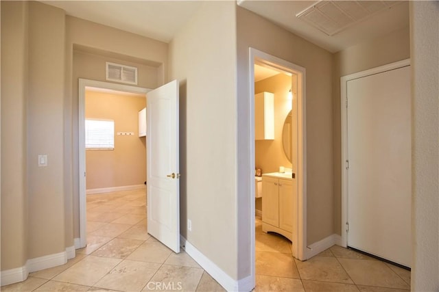 23531 Hobart Ct, Murrieta, CA 92562 - corridor with light tile patterned floors and baseboards
