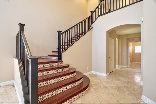 23531 Hobart Ct, Murrieta, CA 92562 - stairway with arched walkways and tile patterned flooring