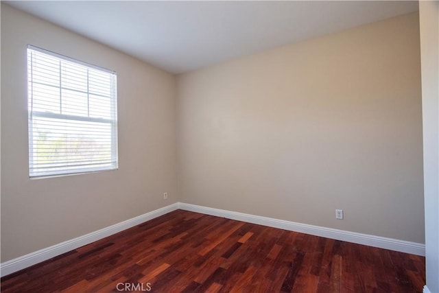 23531 Hobart Ct, Murrieta, CA 92562 - empty room featuring dark wood-type flooring and baseboards