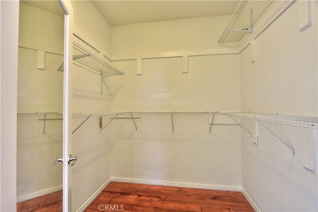 23531 Hobart Ct, Murrieta, CA 92562 - walk in closet featuring wood finished floors